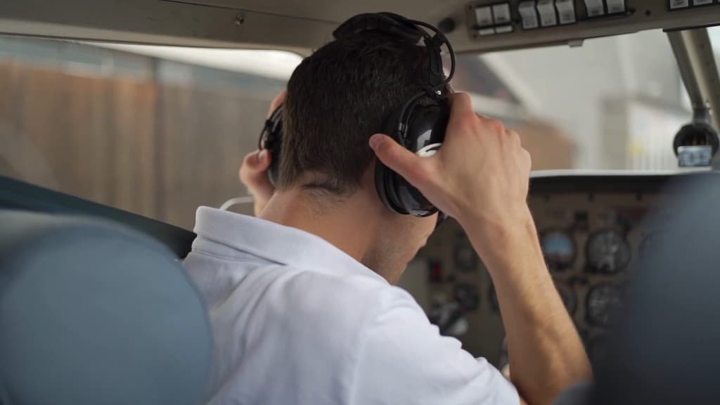 Pilot training with Airman's Ground — headset and cockpit preparation